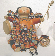 storyteller on drum with children gourd art by robert rivera